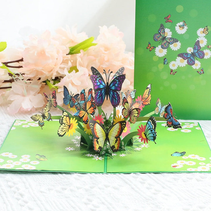 "3D popup-kort prytt med färgglada fjärilar och blommor, perfekt vårpresent i högkvalitativt färgkortspapper."