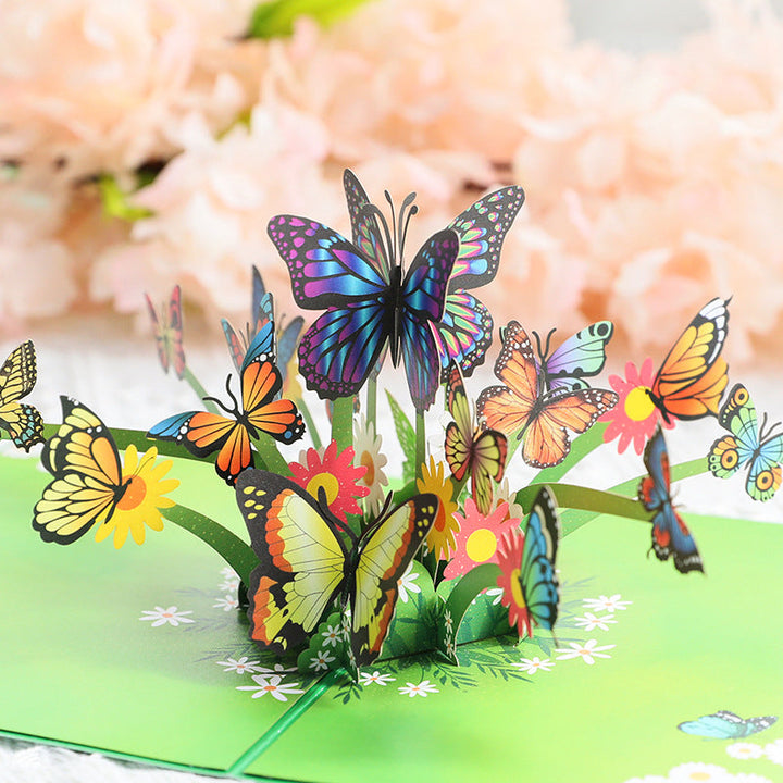 "3D popup-kort prytt med färgglada fjärilar och blommor, perfekt vårpresent i högkvalitativt färgkortspapper."