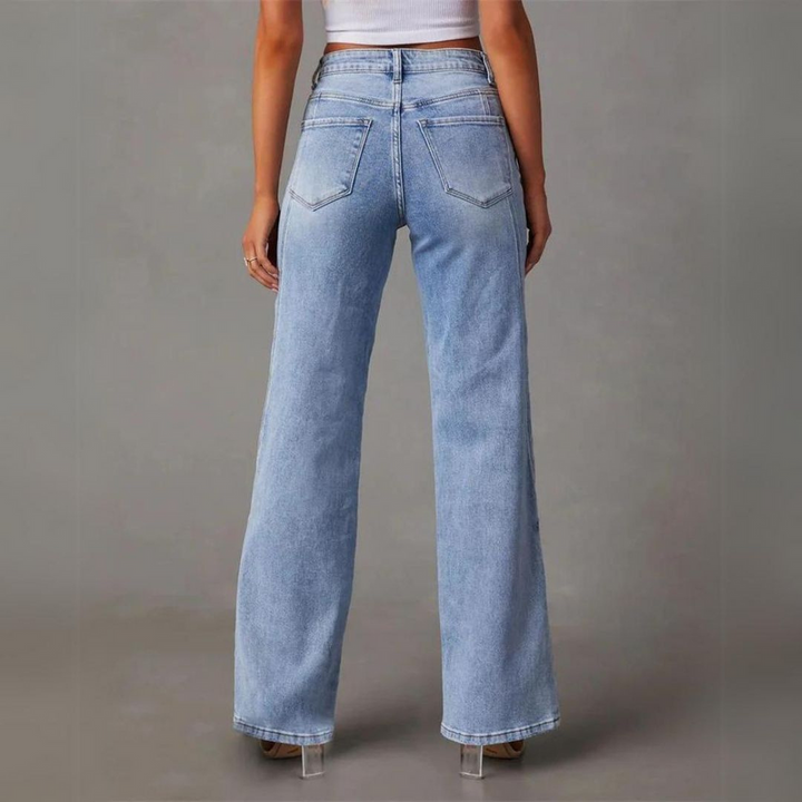"Blå denim högmidjade vida jeans för damer, visar storlekar 34-44, slitstarkt material med klassisk stil"