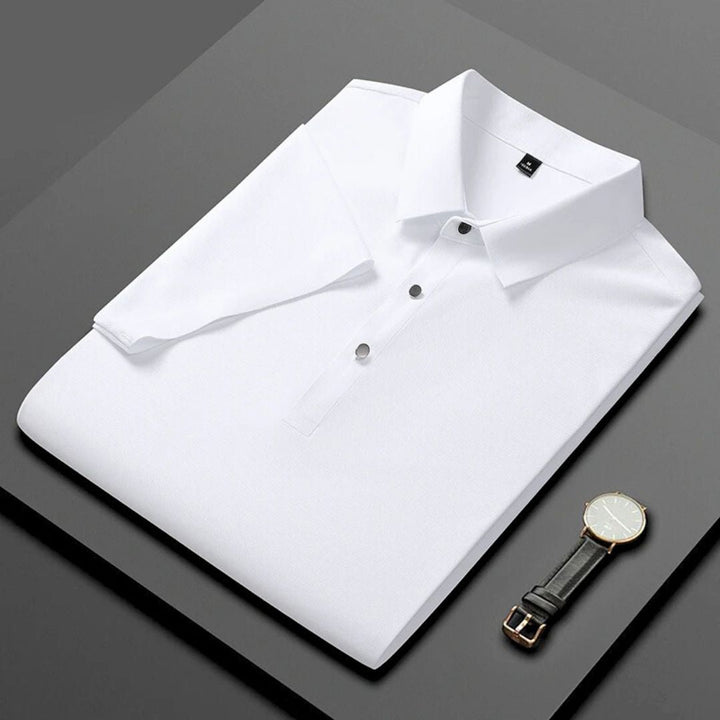Blå herr polo t-shirt med fukttransporterande, andningsbart tyg och fyra-vägs stretch, perfekt för stil och komfort.