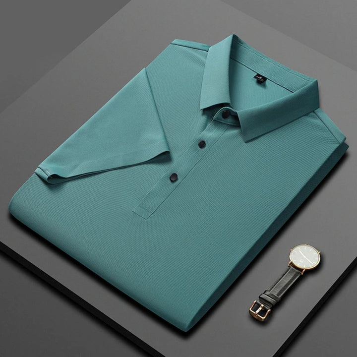 Blå herr polo t-shirt med fukttransporterande, andningsbart tyg och fyra-vägs stretch, perfekt för stil och komfort.
