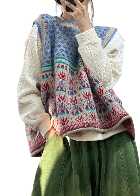 "Blå oversized ullblandad damväst, iögonfallande mönster, ärmlös design för lager-på-lager stil."