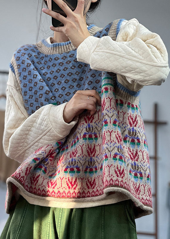 "Blå oversized ullblandad damväst, iögonfallande mönster, ärmlös design för lager-på-lager stil."
