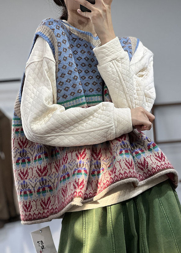 "Blå oversized ullblandad damväst, iögonfallande mönster, ärmlös design för lager-på-lager stil."