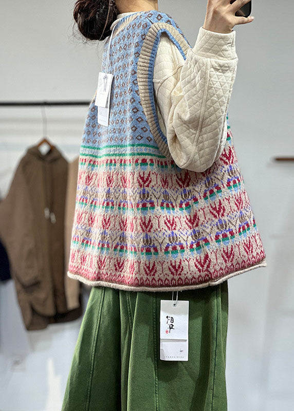"Blå oversized ullblandad damväst, iögonfallande mönster, ärmlös design för lager-på-lager stil."