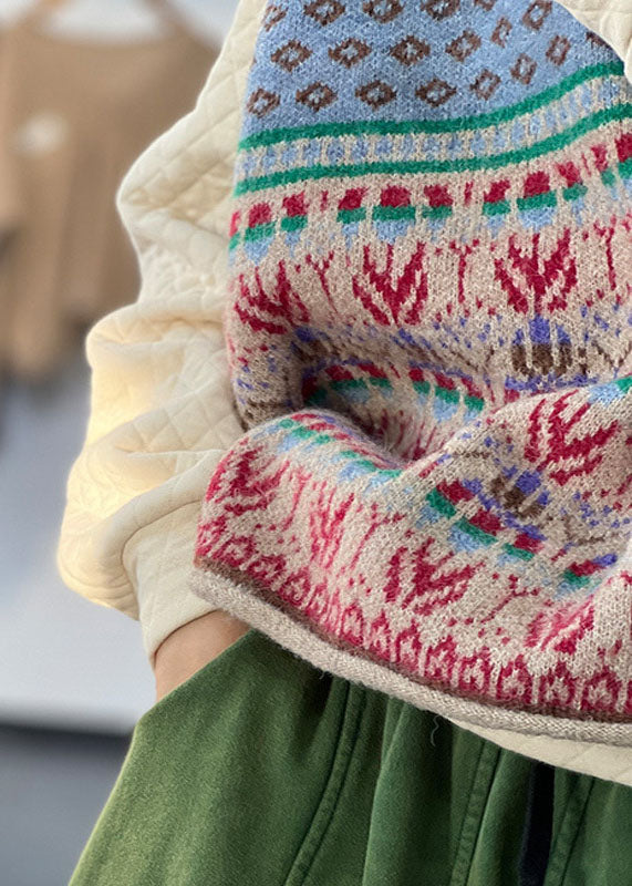 "Blå oversized ullblandad damväst, iögonfallande mönster, ärmlös design för lager-på-lager stil."