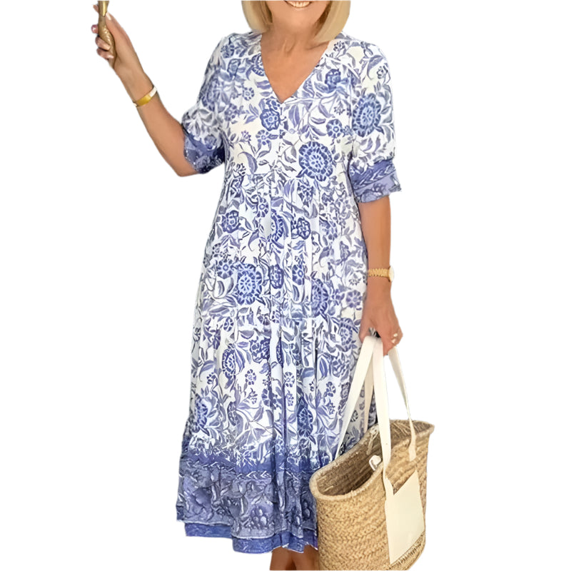 "Bohemisk dam maxiklänning med V-ringning och färgstarka blommönster, elegant fall och elastisk midja för en boho-look."