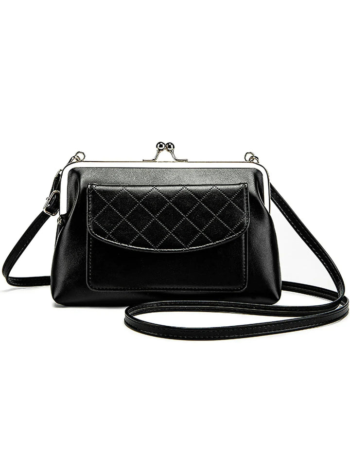 "Dam crossbody väska med läppformad stängning i svart och gul, kompakt design i konstläder, perfekt för stil och funktion."