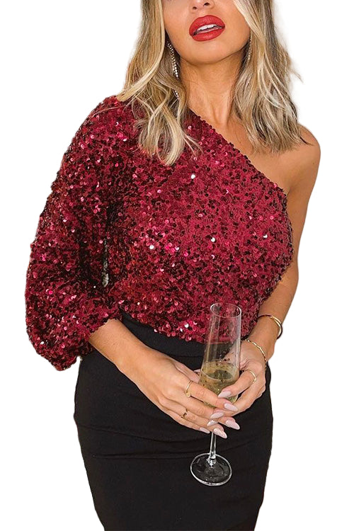 Dam festtopp en axel, glittrande paljetter, elegant, glamourös, perfekt för fest, fångar ljus med skimrande finish.