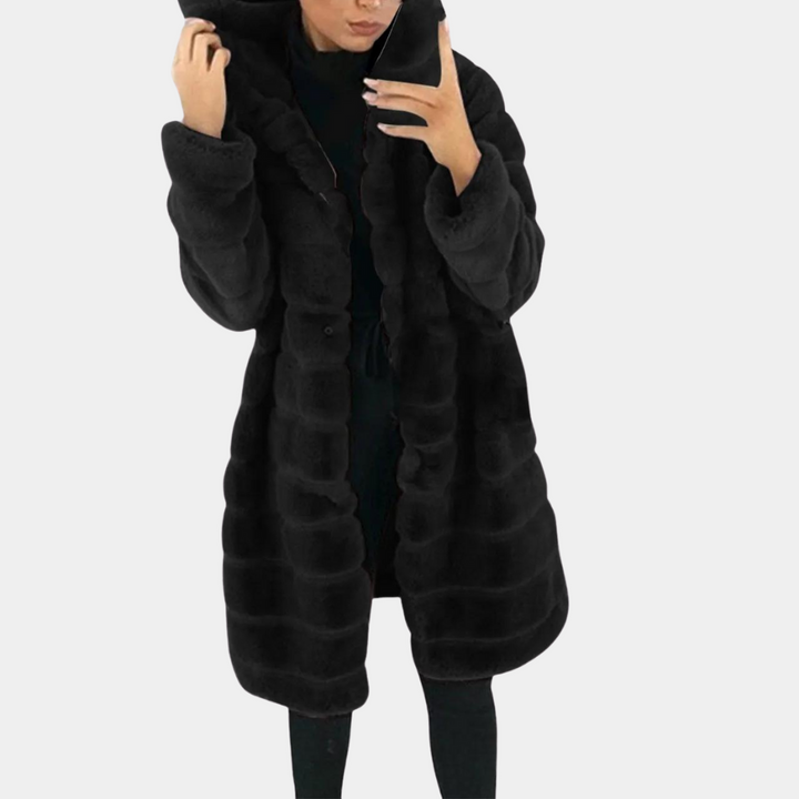 "Dam fleecejacka med huva, elegant och funktionell, perfekt för kalla dagar med stil och komfort."