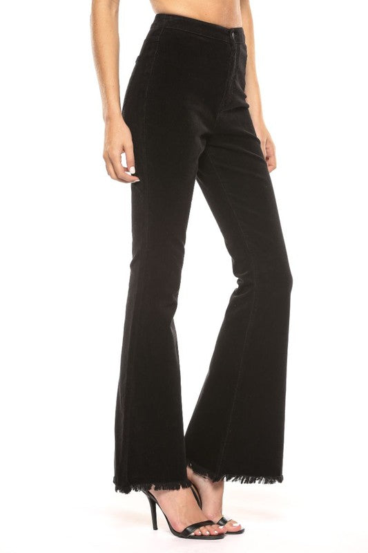 "Dam högmidjade svarta corduroy super flare jeans, retro och modern stil, smickrande passform, dramatisk flare."
