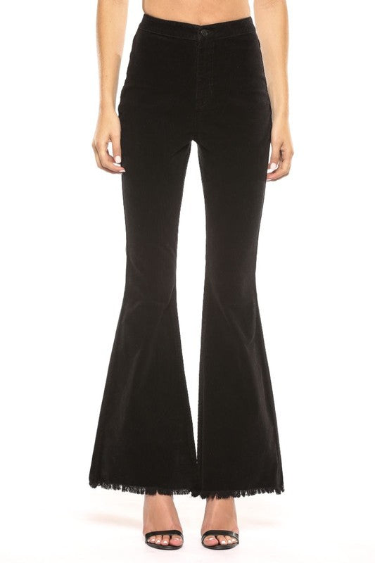 "Dam högmidjade svarta corduroy super flare jeans, retro och modern stil, smickrande passform, dramatisk flare."