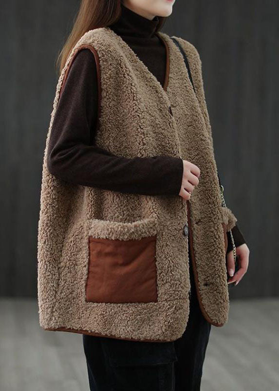 Dam khaki blusväst med knappfickor fram, löskragad design, perfekt för lager-på-lager styling och olika kroppstyper.