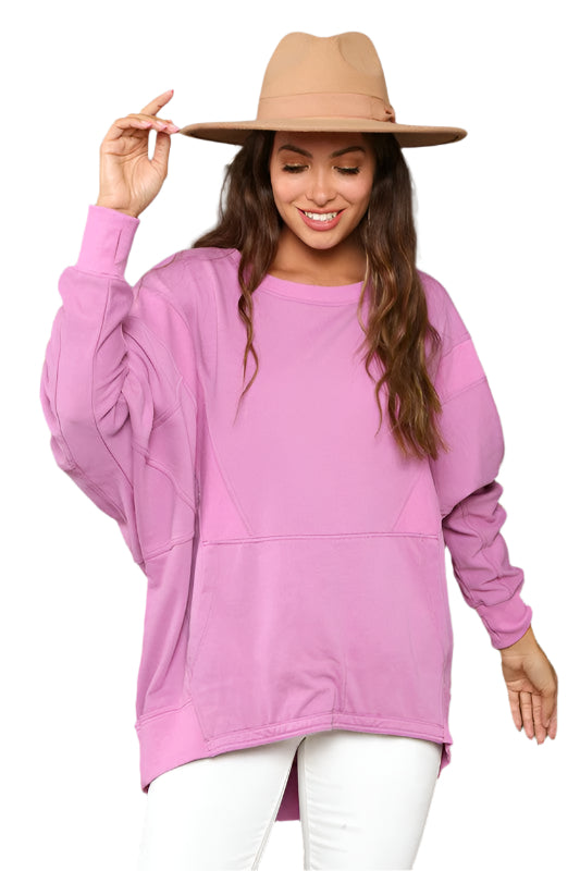 Dam kontrastfärgad magenta sweatshirt, mjukt French Terry-material, avslappnad passform, elegant och iögonfallande design.
