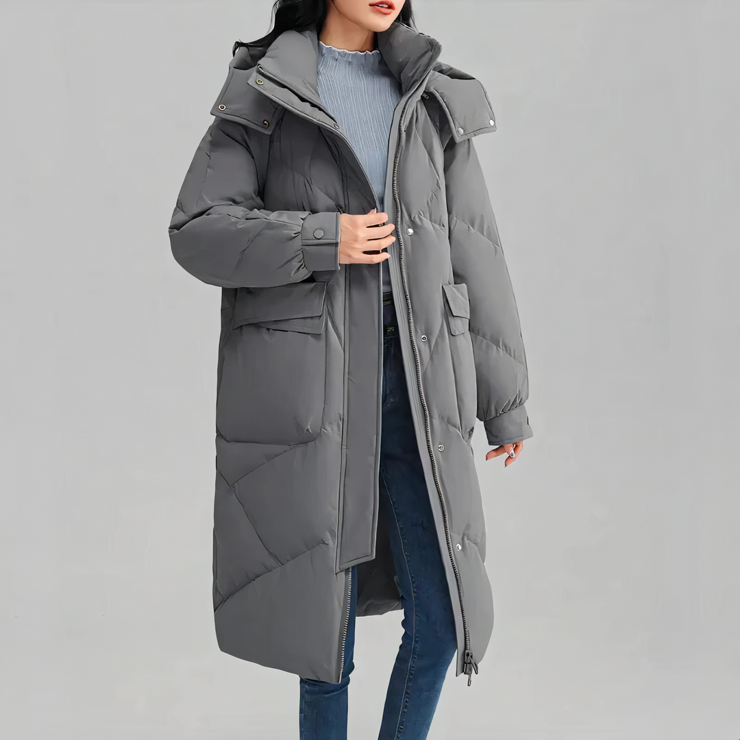 "Dam lång vinterjacka fram, värmande och elegant med sofistikerad design, perfekt för kalla dagar."