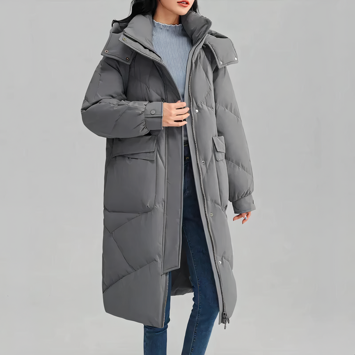 "Dam lång vinterjacka fram, värmande och elegant med sofistikerad design, perfekt för kalla dagar."