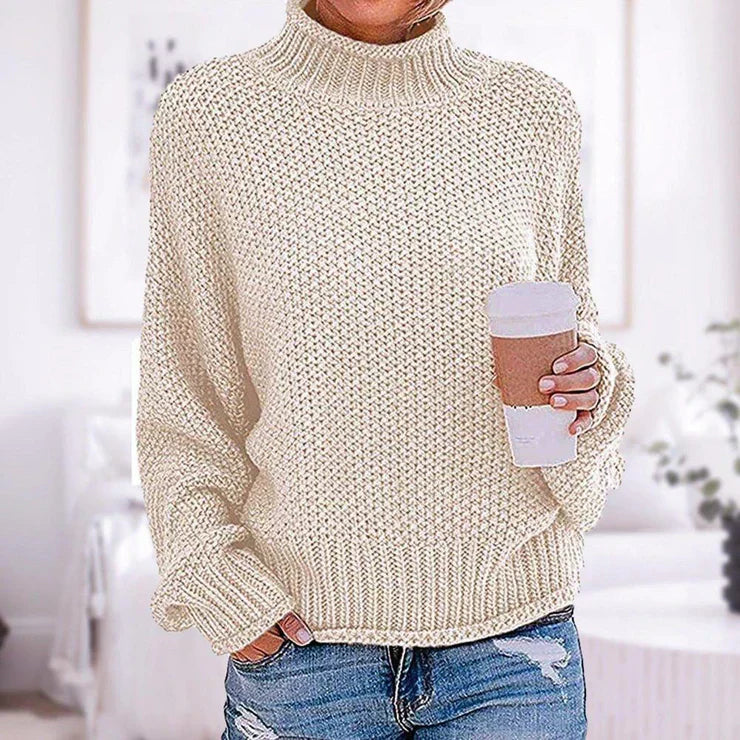 "Dam långärmad baströja i bomull-polyester mix, visad framifrån. Minimalistisk design för vardag och arbete."