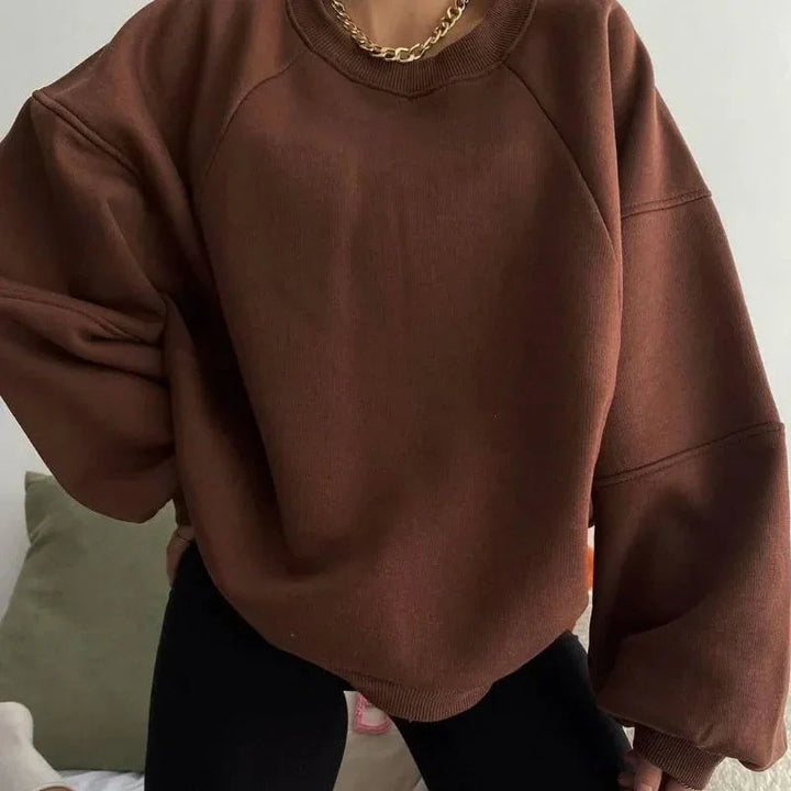 "Dam oversized sweatshirt med avslappnad passform, rund hals och långa ärmar, perfekt för stil och bekvämlighet."