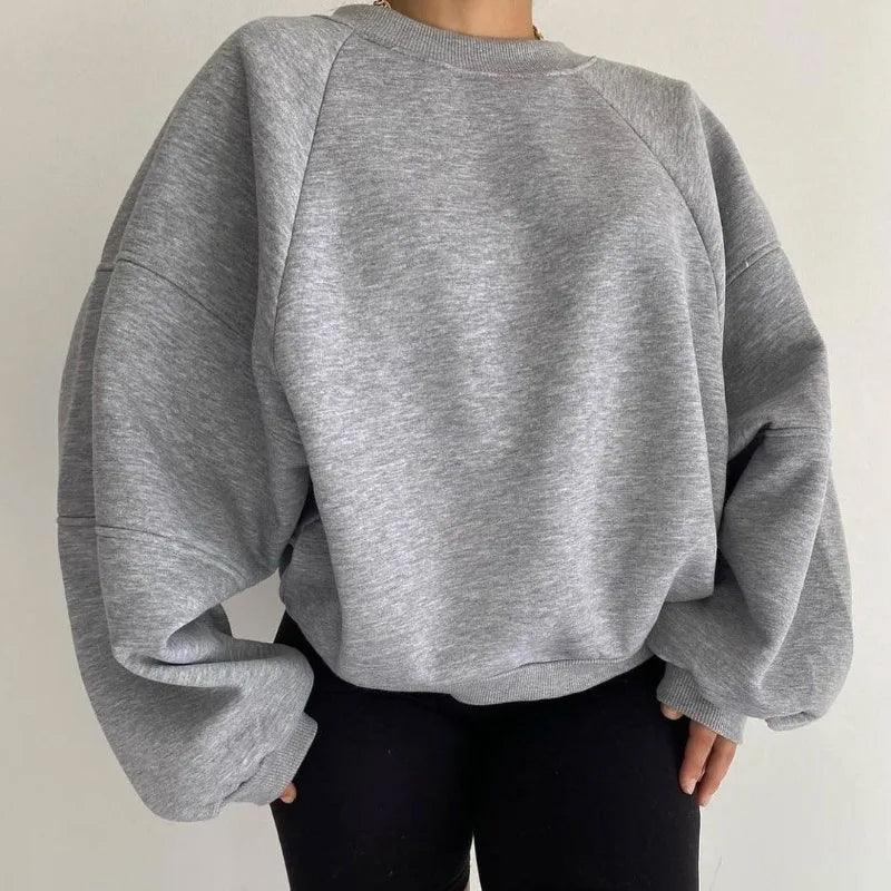 "Dam oversized sweatshirt med avslappnad passform, rund hals och långa ärmar, perfekt för stil och bekvämlighet."