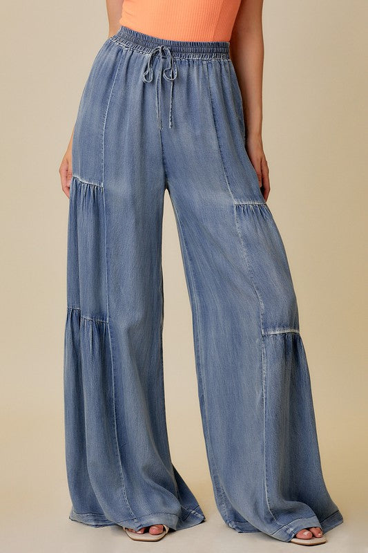 "Dam vida jeans med volanger, tvättad denim, elegant stil och avslappnad passform, perfekt för alla tillfällen."