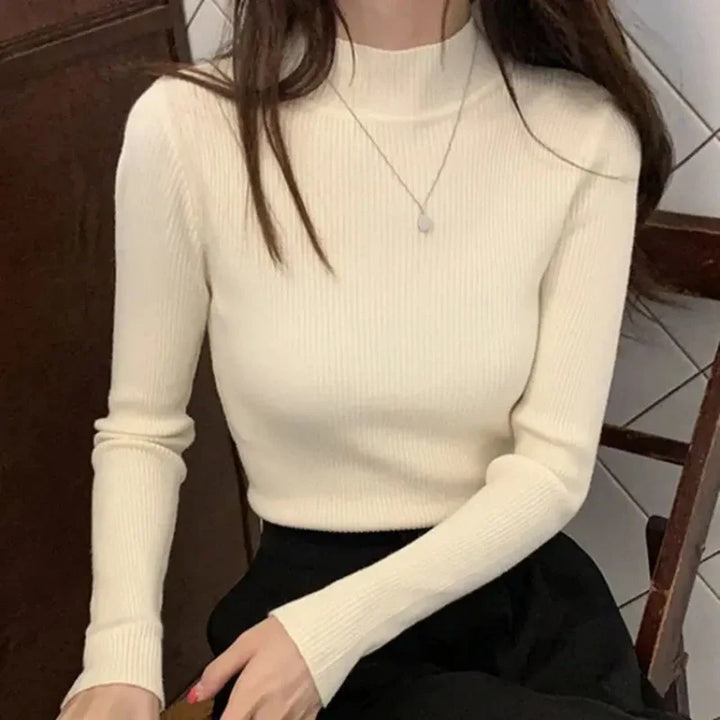 "Dam vintage stickad tröja med mock neck, flera färger. Elegant och varm design för kyliga dagar, perfekt för garderoben."