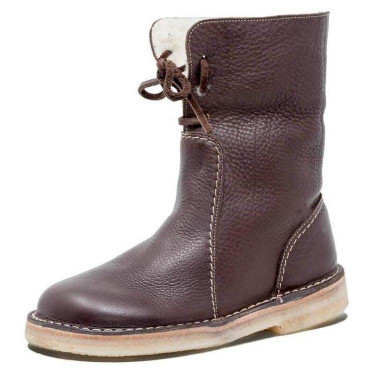 "Damboots vattentäta fleece med ullfoder, tidlös design, flera färger. Perfekt för vinterkomfort och stil."
