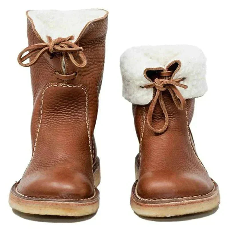 "Damboots vattentäta fleece med ullfoder, tidlös design, flera färger. Perfekt för vinterkomfort och stil."