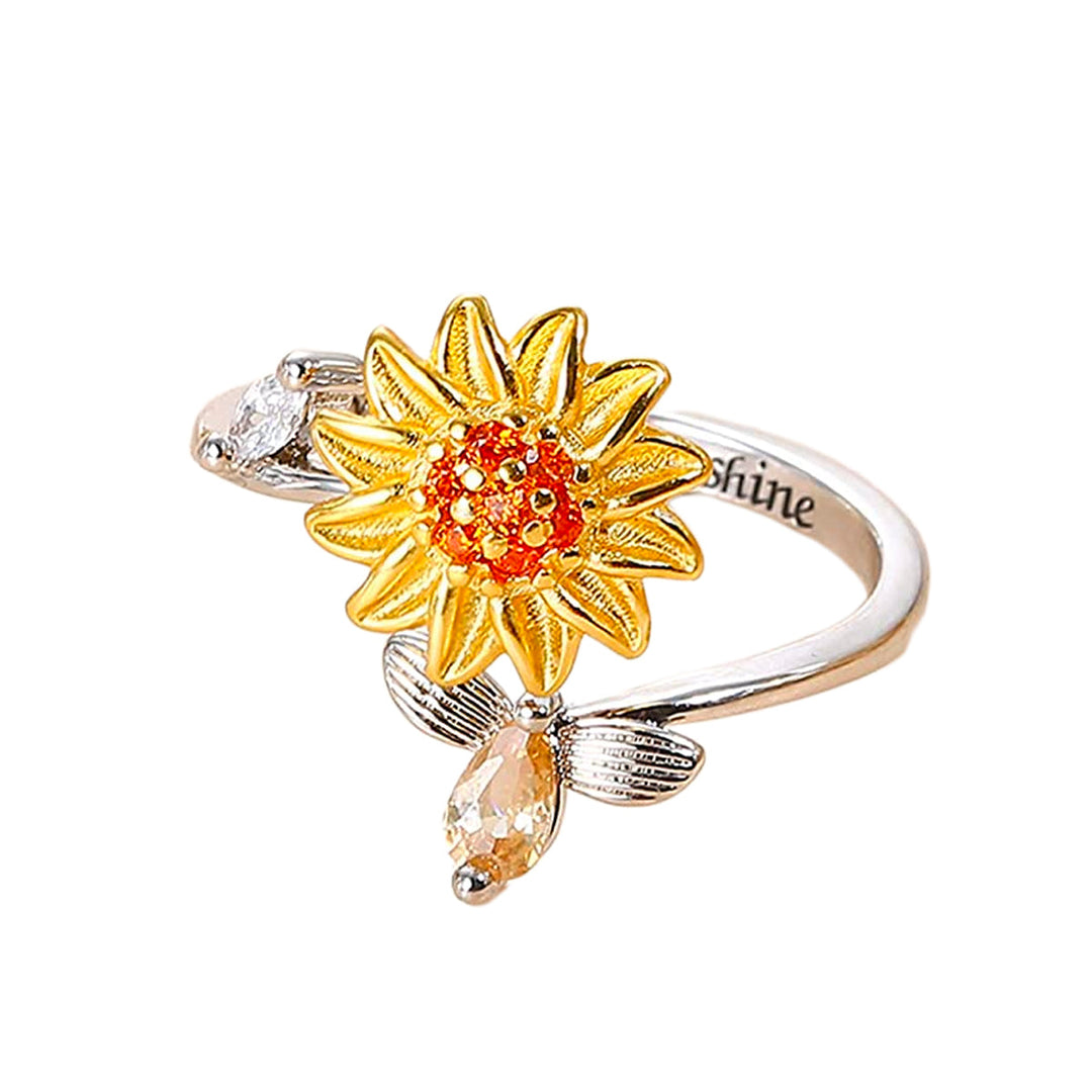 "Damer Solros Fidget Ring: Elegant ångestlindrande ring med roterbar blommig design i guld och cubic zirconia."