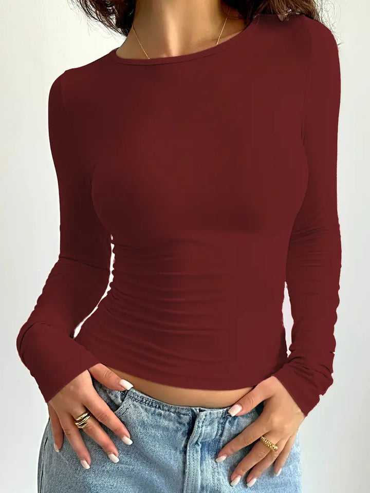 "Damer långärmad T-shirt, rund hals, i bomull. Perfekt för alla tillfällen med elegant och tidlös design."