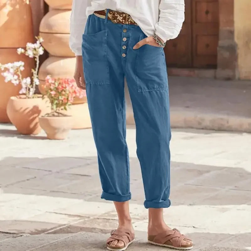 "Damer oversize långa byxor med fickor i bomull och linne, framifrån bild. Perfekt sommarplagg för stil och komfort."