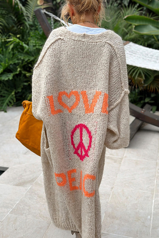 "Damer oversized cardigan i midilängd med unikt tryck, överdimensionerad passform, och fickor för bekväm stil."