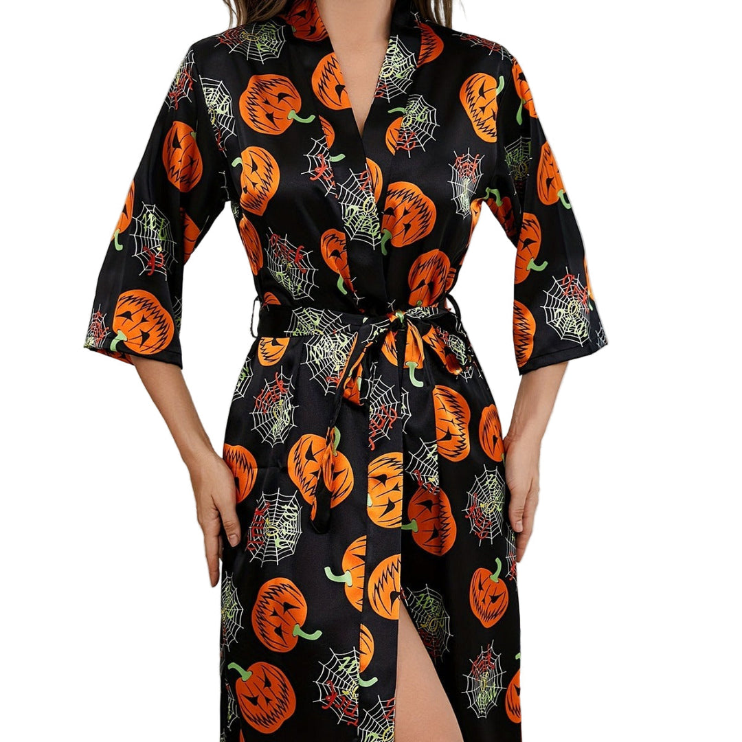 "Damernas Halloweenklänning med djärvt pumpamönster och lätt tyg, idealisk för festlig och bekväm halloween-look"