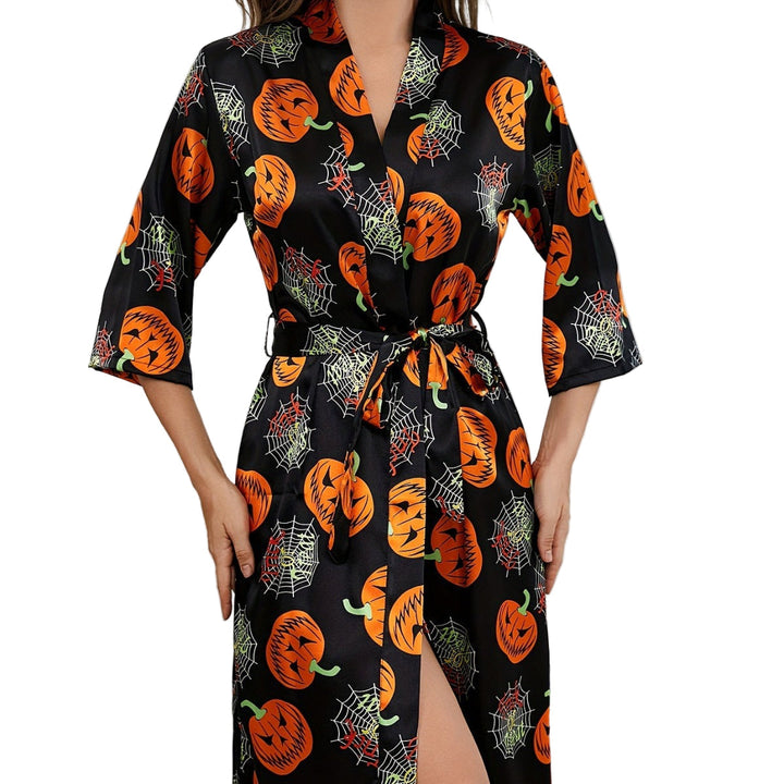 "Damernas Halloweenklänning med djärvt pumpamönster och lätt tyg, idealisk för festlig och bekväm halloween-look"