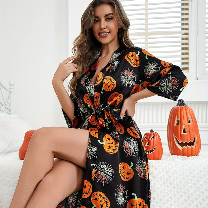 "Damernas Halloweenklänning med djärvt pumpamönster och lätt tyg, idealisk för festlig och bekväm halloween-look"