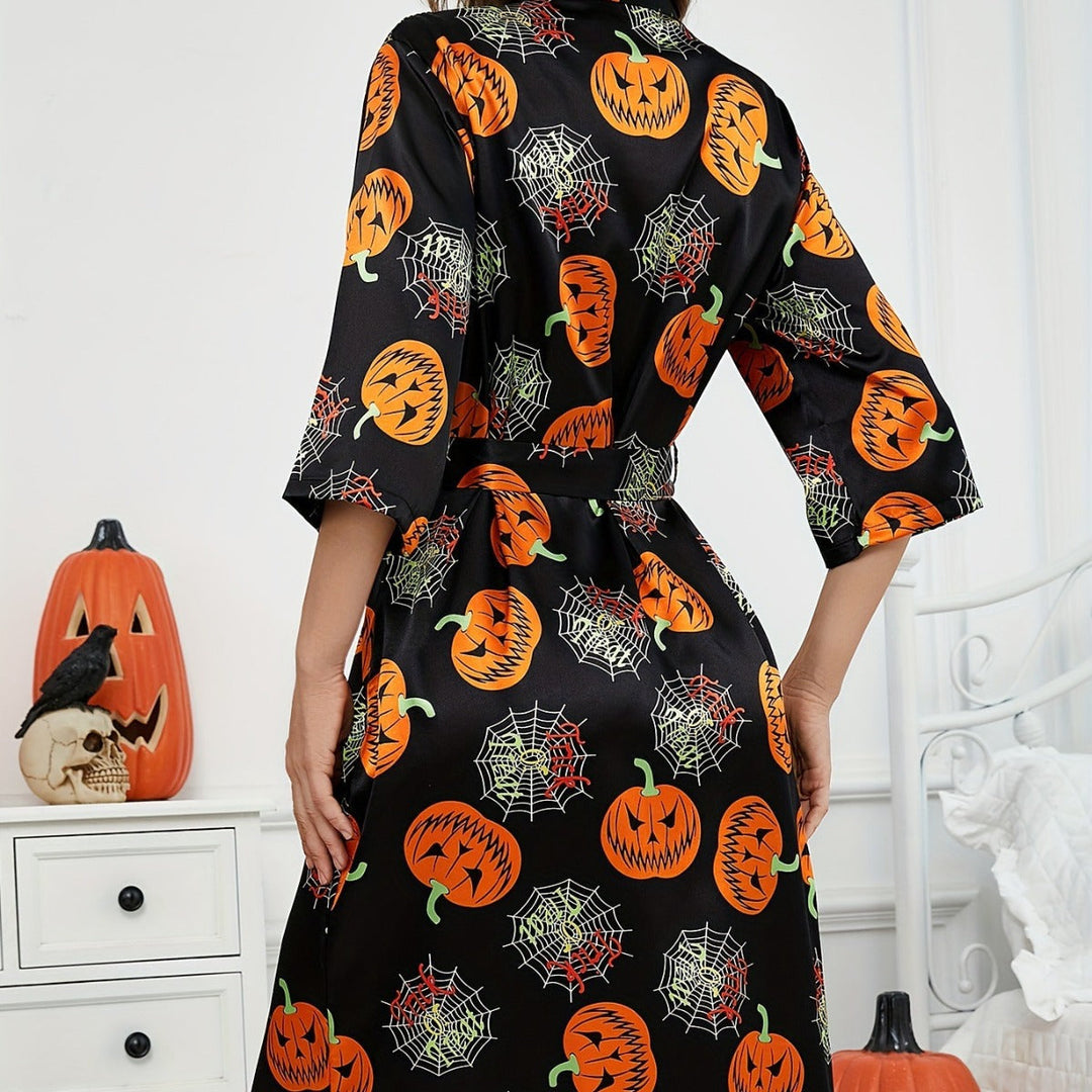 "Damernas Halloweenklänning med djärvt pumpamönster och lätt tyg, idealisk för festlig och bekväm halloween-look"