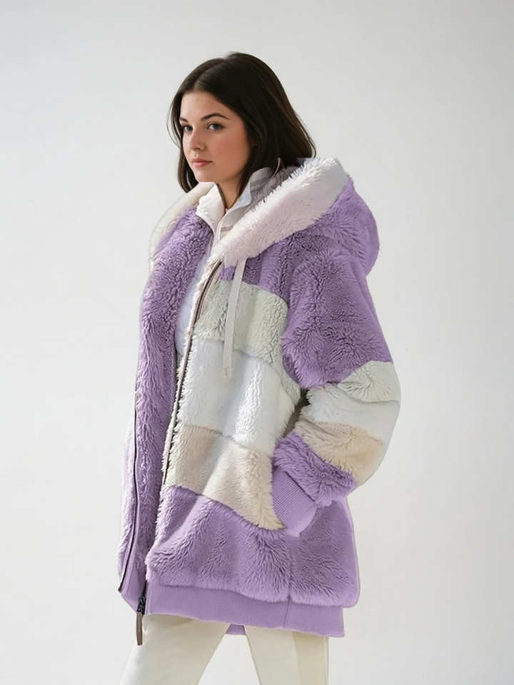 Damernas paddad långjacka med chic design, kontrasterande mönster, mjukt fuskpälsfoder, perfekt för kallt vinterväder.
