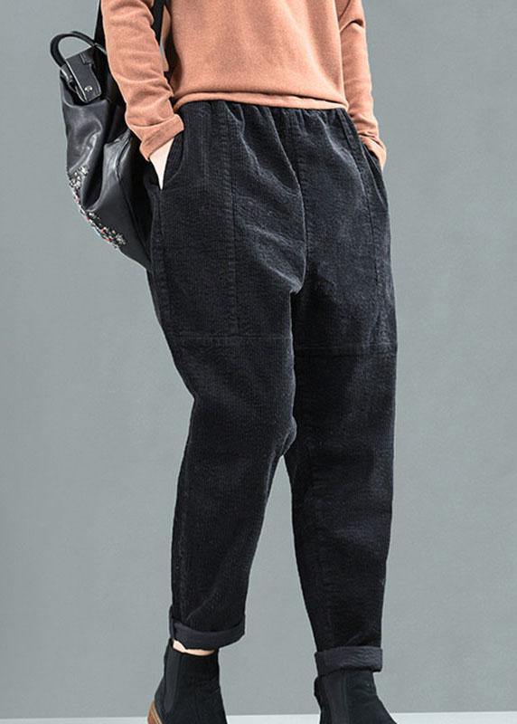 Damernas patchwork harembyxor med fickor, avslappnad passform i gröna och bruna toner för unik och bekväm stil.