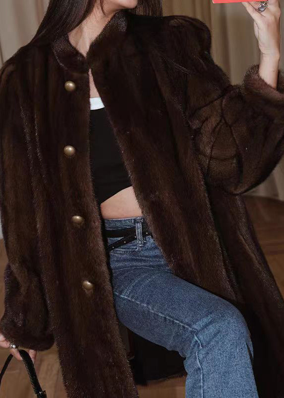 "Dammig långärmad tröja med O-halsknapp, mjukt och fluffigt material, perfekt för vår och höst."