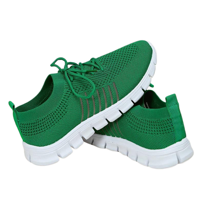 "Damsneakers grön med mjuk sula och nätöverdel. Rund tå, snörning, andningsförmåga och halkfri gummisula."