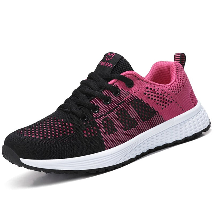 "Damsneakers i ventilerande mesh med platt sula och casual stil, säker snörning, idealiska för dagliga promenader."