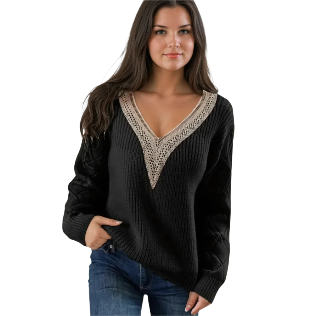 "Damstickad V-ringad pullover med mjuk textur och detaljerade ärmar, perfekt för elegant lager-på-lager stil."