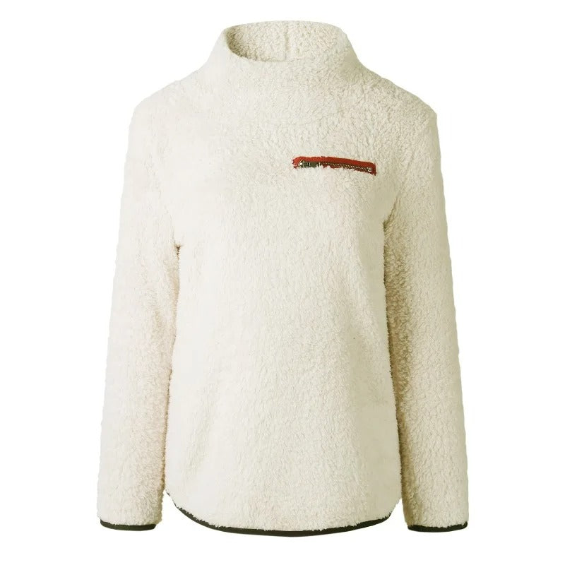 "Damtopp med sköldpaddshals i supermjukt tyg, neutral färg, stilren design. Perfekt för jeans eller leggings."