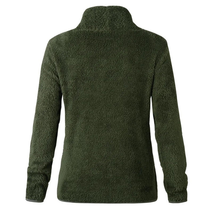 "Damtopp med sköldpaddshals i supermjukt tyg, neutral färg, stilren design. Perfekt för jeans eller leggings."