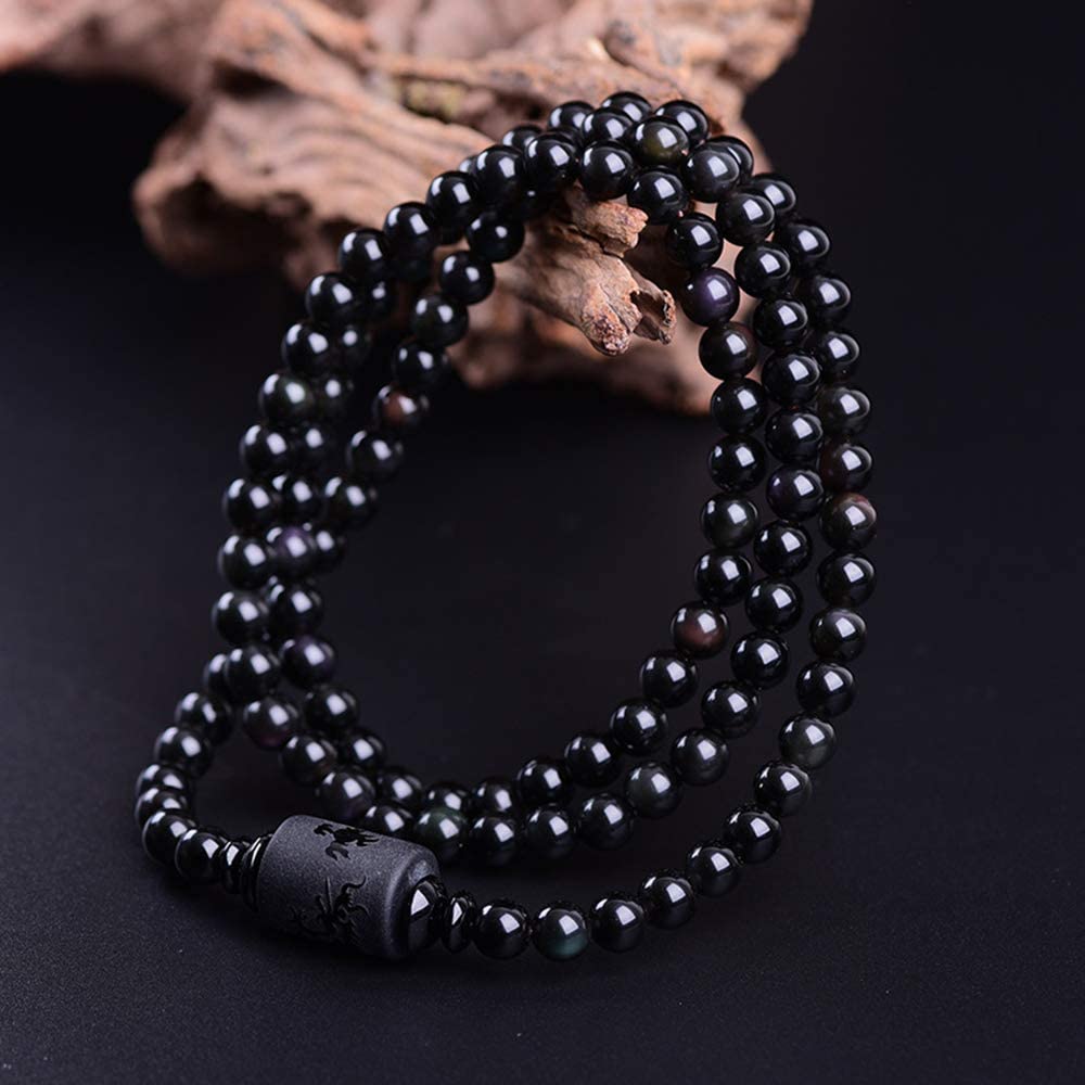 "Drake & Fenix Yin-Yang armband i svart och grått, designat för män och kvinnor med glaspärlor för harmoni och balans."