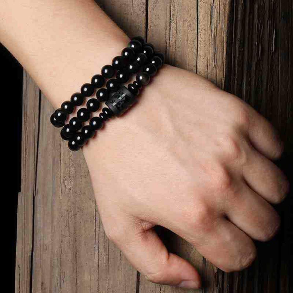 "Drake & Fenix Yin-Yang armband i svart och grått, designat för män och kvinnor med glaspärlor för harmoni och balans."