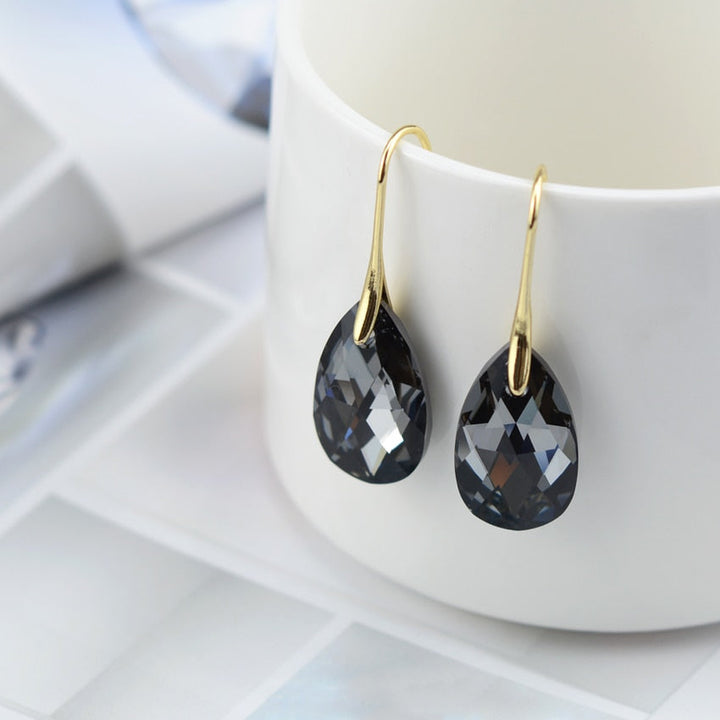 Droppformade kristallörhängen för kvinnor med blå akvamarinstenar och CZ-zirkonia, pläterade med sterling silver.