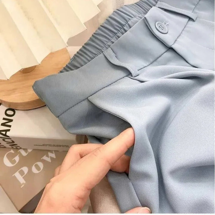 Elastiska byxor med hög midja för dam, svart färg, bekväm design, tidlös stil, perfekt för vardag och fest.