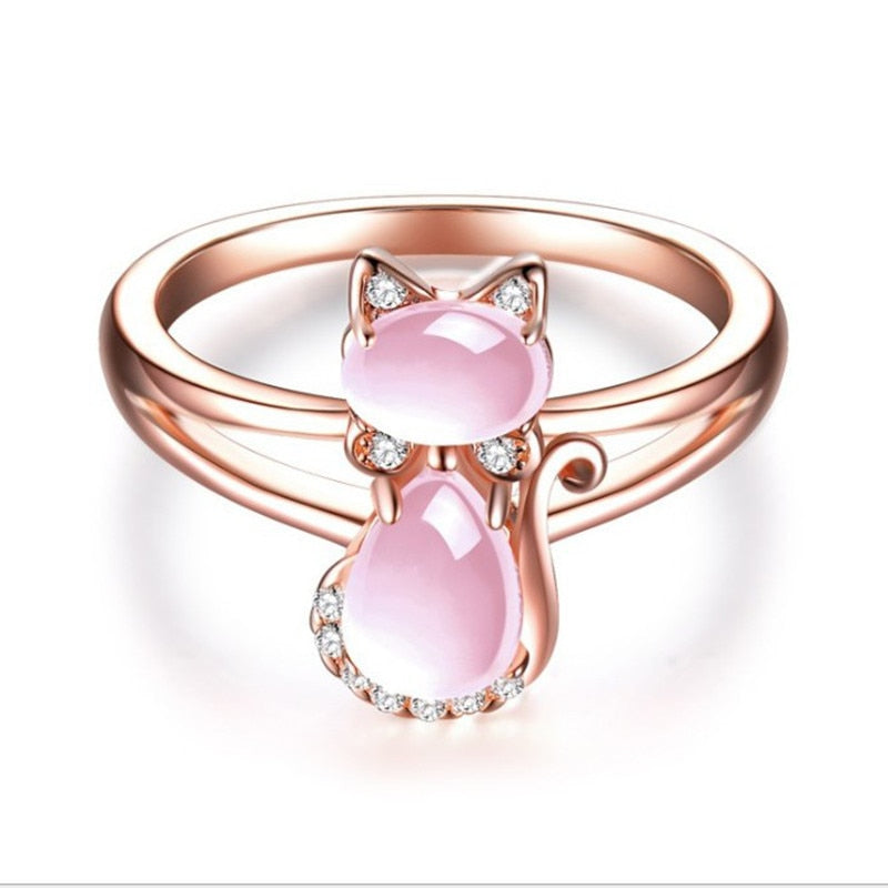 "Elegant S-form katt ring i 14K roséguld med rosa opaler och cubic zirconia, perfekt accessoar för kvinnor."