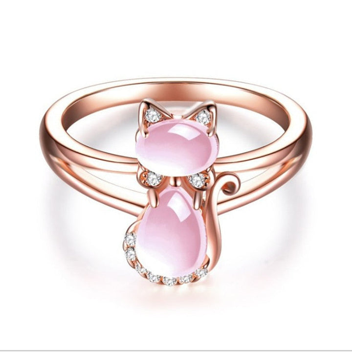 "Elegant S-form katt ring i 14K roséguld med rosa opaler och cubic zirconia, perfekt accessoar för kvinnor."