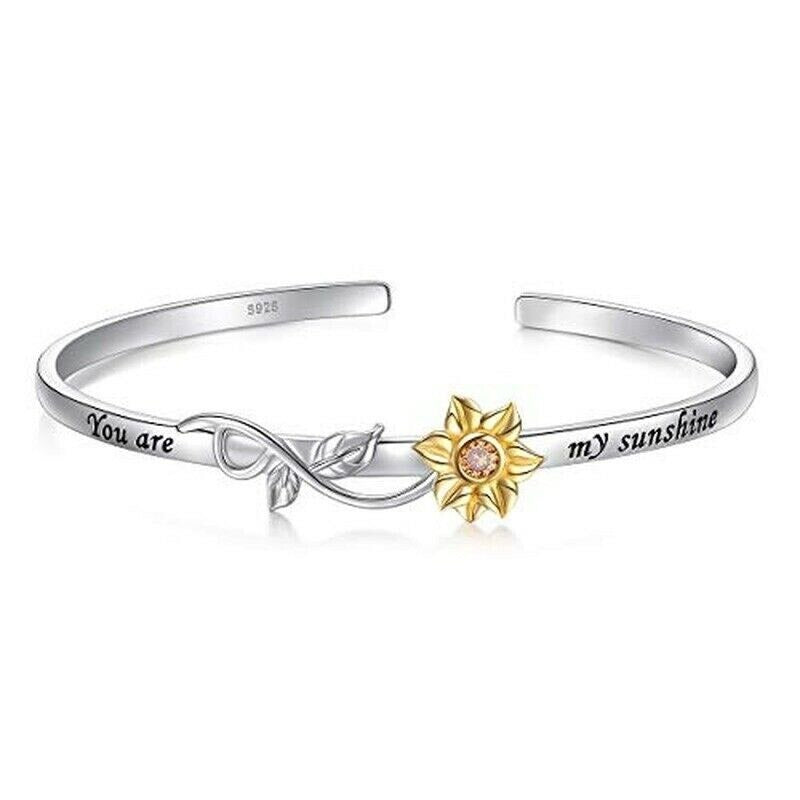 "Elegant armband för kvinnor med solrosdetaljer, chic design med utsökt blommig detaljering för en stilfull look."